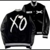 XO Varsity Jacket black wool blend body with leather sleeves XO logo patch on the back and embroidered front details classic varsity style